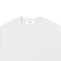 A white short-sleeve crewneck t-shirt with a small black 'Lovedfirst' logo printed on the lower right front, displayed flat against a solid white background.