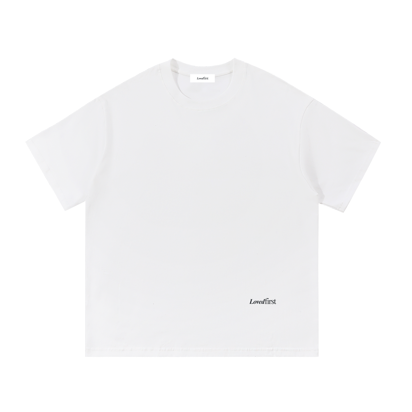 A white short-sleeve crewneck t-shirt with a small black 'Lovedfirst' logo printed on the lower right front, displayed flat against a solid white background.