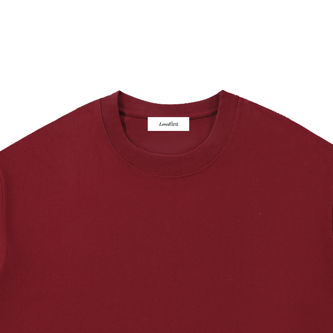 A dark red crewneck t-shirt with a small white 'Loudfirst' logo printed on the bottom right, displayed flat against a solid white background.
